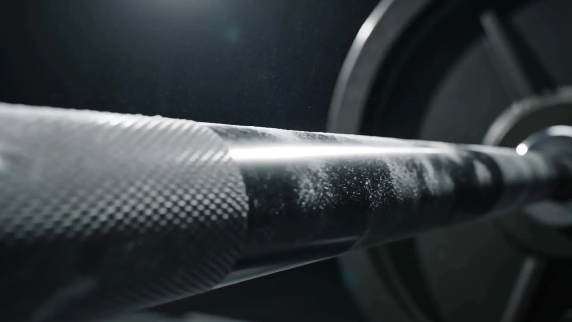 Close-up of a knurled barbell and plate in dark light, AI-generated frame