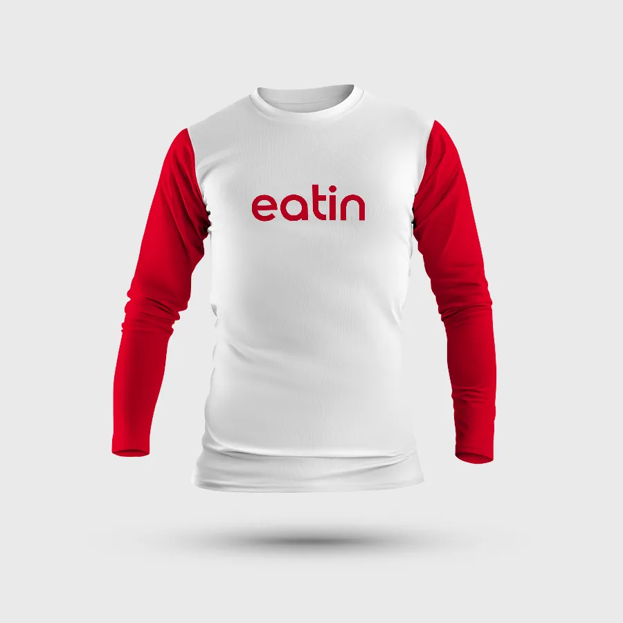 Mockup of a long-sleeved T-shirt with a white body, red sleeves and the red eatin wordmark across the chest