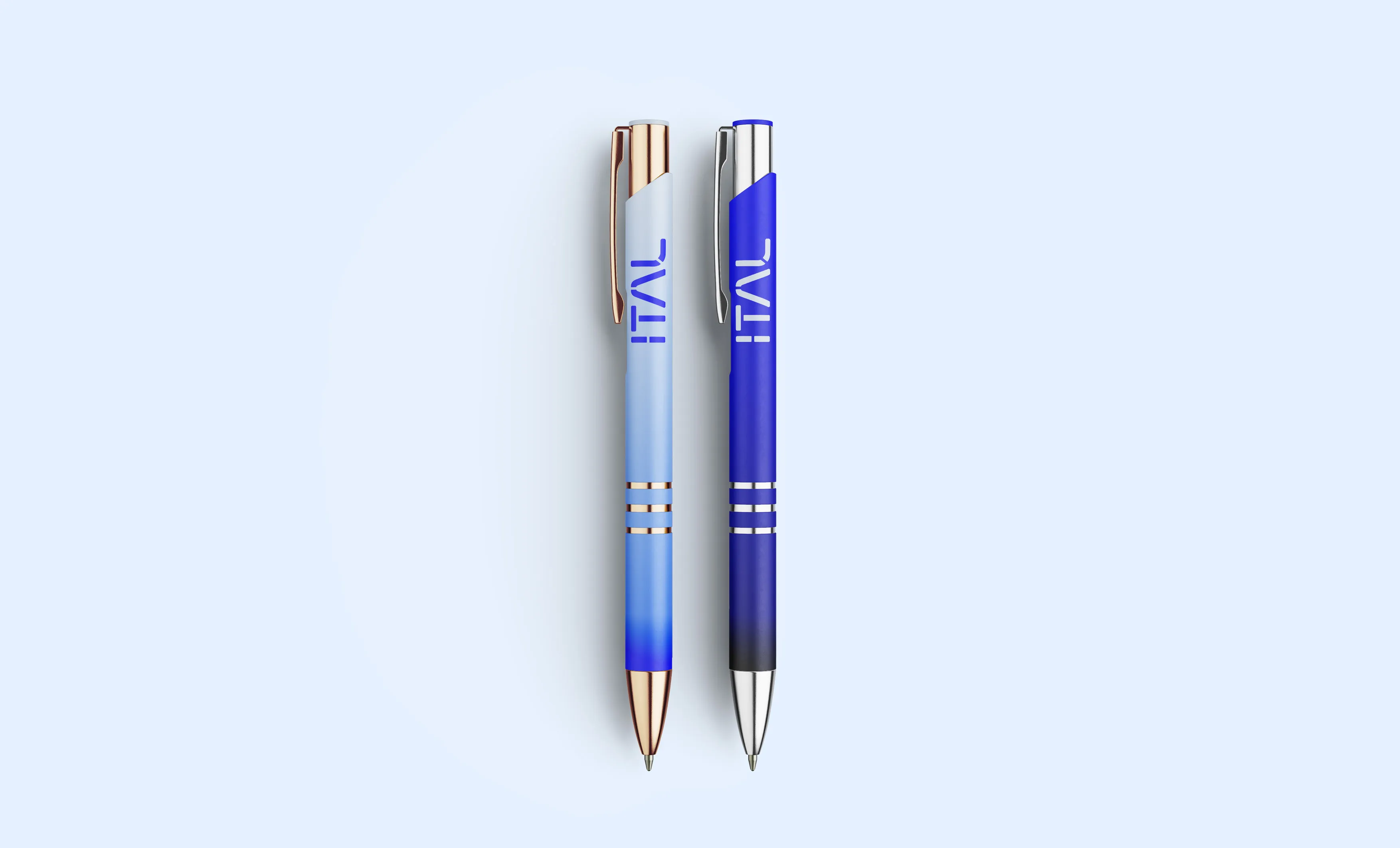 Mockup of two ITAL pens, one pale blue with copper trim, one deep blue with chrome trim