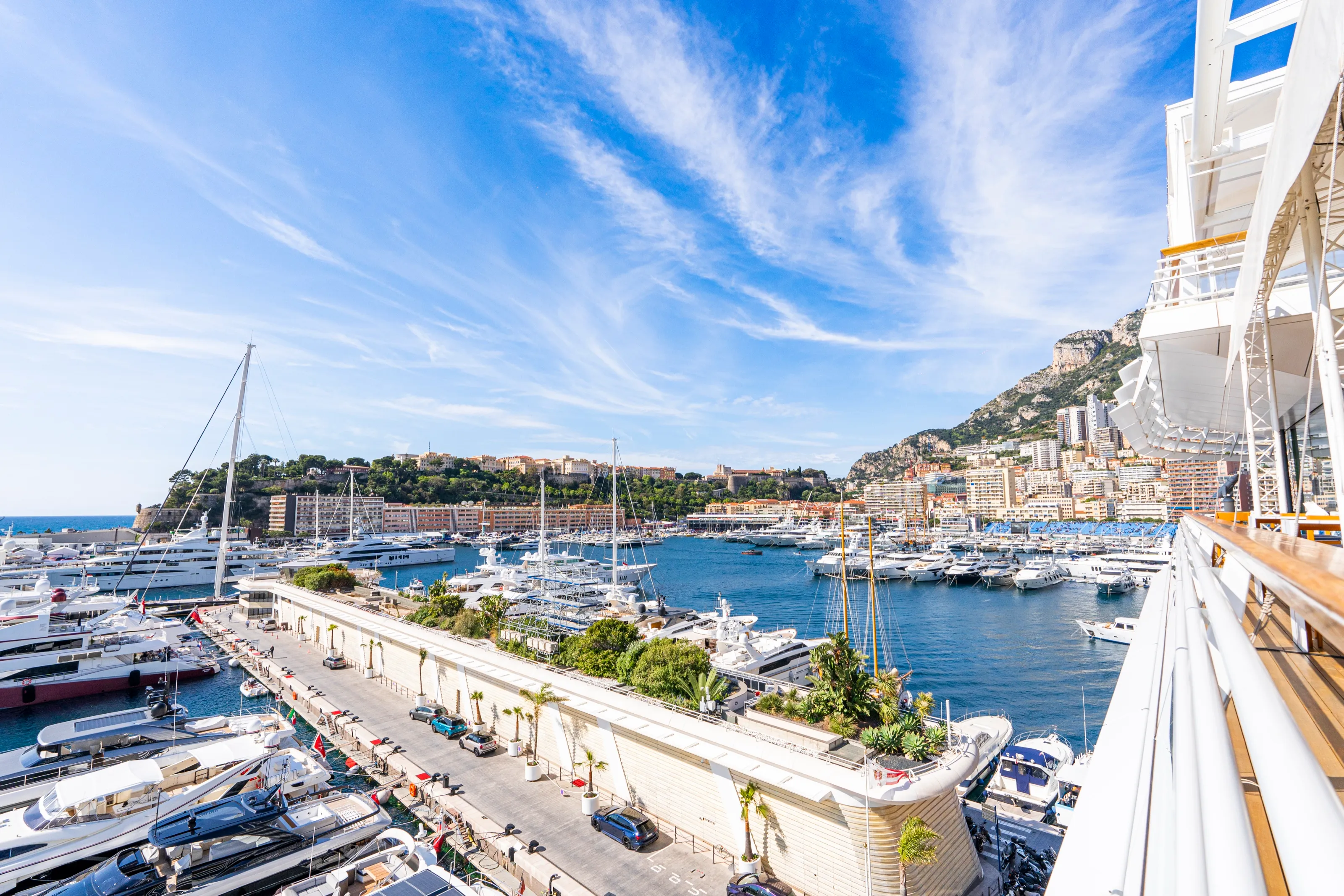 Port Hercule seen from the terrace, full of yachts under a blue sky